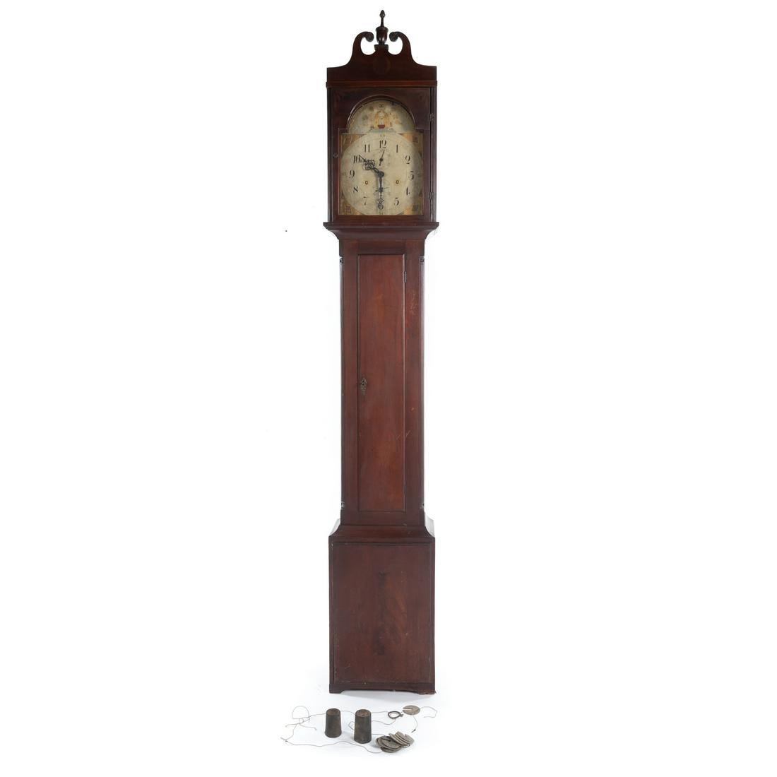 Federal Mahogany Tall Case Clock: Mid-Atlantic; broken arch pediment, with painted wood Masonic dial, with fluted columns, on molded base, 96 in. H., 16 in. W., 10 in. D.