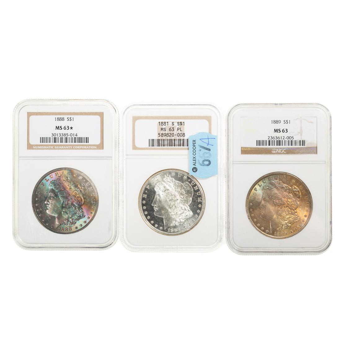 Three Nice NGC 63 Dollars with Toning, One PL: 1881-S NGC MS63 PL Reverse is rainbow toned and quite lovely with the mirrors; 1888 NGC MS63 Star with an obverse darkly toned with multi-colors; 1889 NGC MS63 golden russet toning on the obverse with