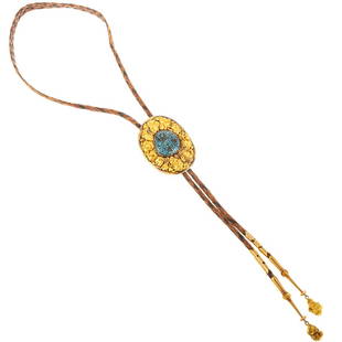 A Navajo 14K & Turquoise Bolo Tie by Peter Nelson: 14K yellow gold and spiderweb turquoise bolo tie by Navajo artist Peter Nelson, featuring an oval setting with free-form nuggets centering a turquoise spiderweb cabochon, elaborate 14K bolo tips with