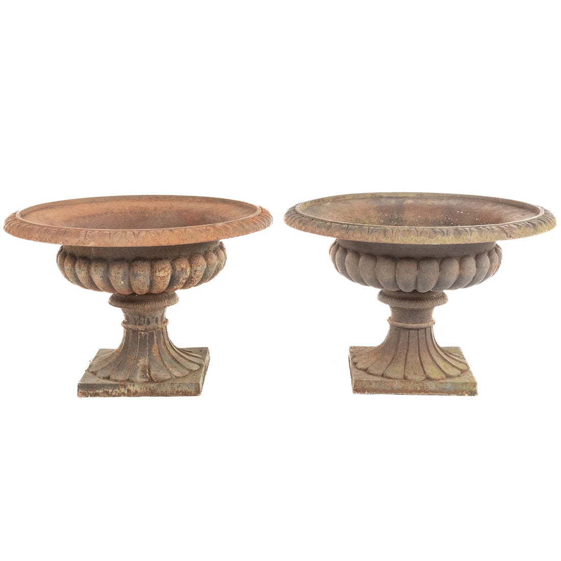 A Pair of Cast Iron Garden Urns: Late 19th century; squat rib form planter urns, 19 in. H., 30 in. Diam.