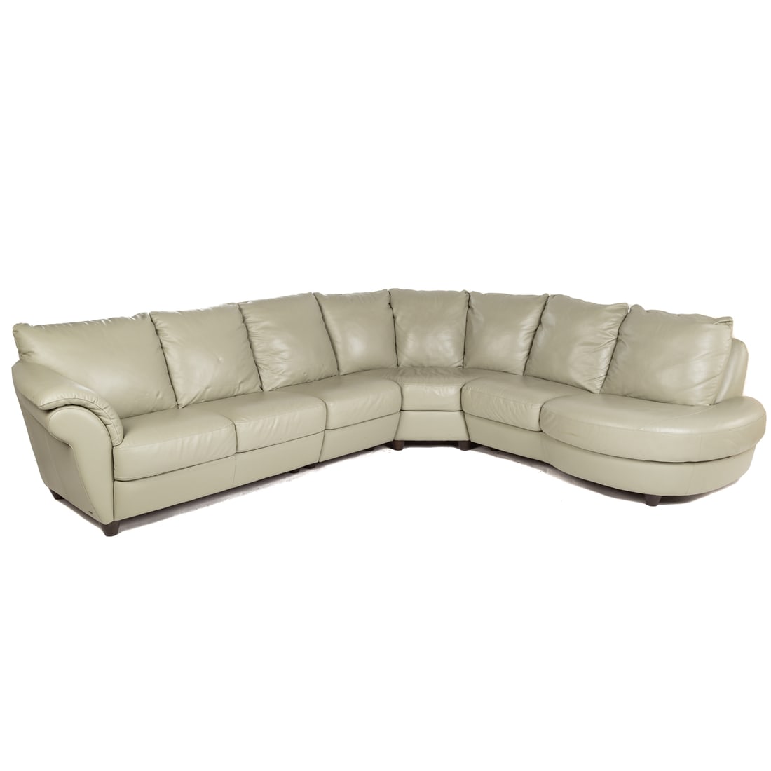 Natuzzi Contemporary Leather Sectional Sofa: 20th century; made in Italy. Three section sectional sofa with attached cushions, having ebonized wood feet, 34 in. H., 122 in. W., x 104 in. L.