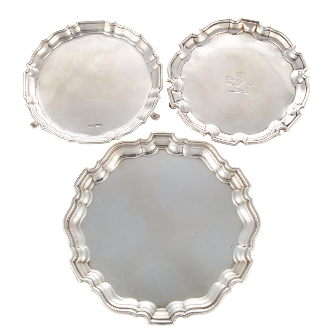 Three English Silver Salvers: Including a George II armorial salver, Joseph Sanders, London, 1733, 1 in. H, 6 1/4 in. Diam., 7.8 ozt. Together with two additional silver salvers: George V, Roberts & Dore Ltd., Sheffield, 1932, 3/4