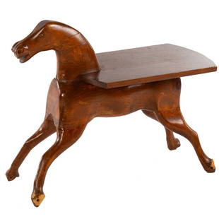 American Folk Art Horse Side Table: First half, 20th century; primitive style carved prancing horse, with table top attached to back, 27 1/2 in. H., 33 in. L., 15 in. W.