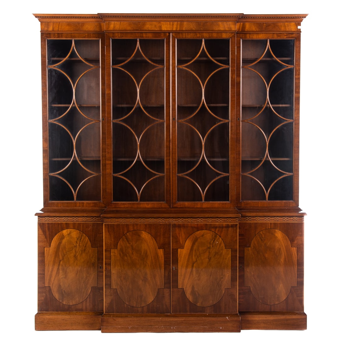 Sacks Marlboro Manor Mahogany Breakfront: 20th century; George III style, with dental molded cornice, four glass panel doors, adjustable shelves, base with four cabinet doors, on molded base, 87 in. H., 70 in. W., 13 3/4 in. D.
