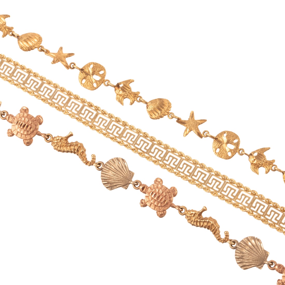A Trio of Link Bracelets in 10K & 14K: 1) 14K yellow, white and rose gold sea life link bracelet made in USA, large lobster clasp, 7.25 in. L, 2) 10K yellow gold sea life link bracelet, barrel clasp with safety latch, 7 in. L, and 3) 10K y