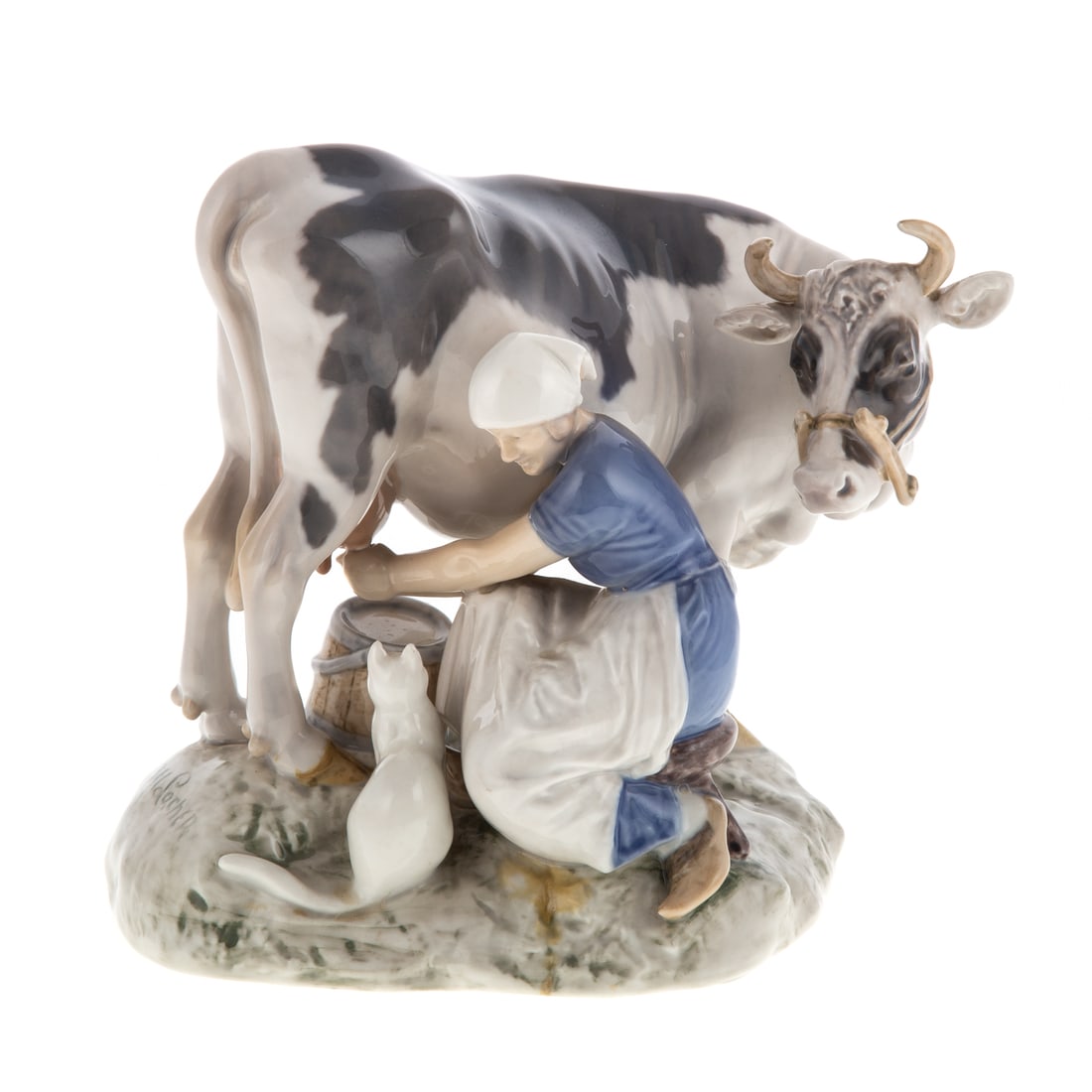 Bing & Grondahl Dairy Maid with Cat: 20th century; #2017, designed by Axel Locher, 6 1/2 in. H., 7 in. W. For further reading see "Bing & Grondahl Porcelain" p.113, by Caroline & Nick Pope. From the Lawrence E. Rubin Collection.