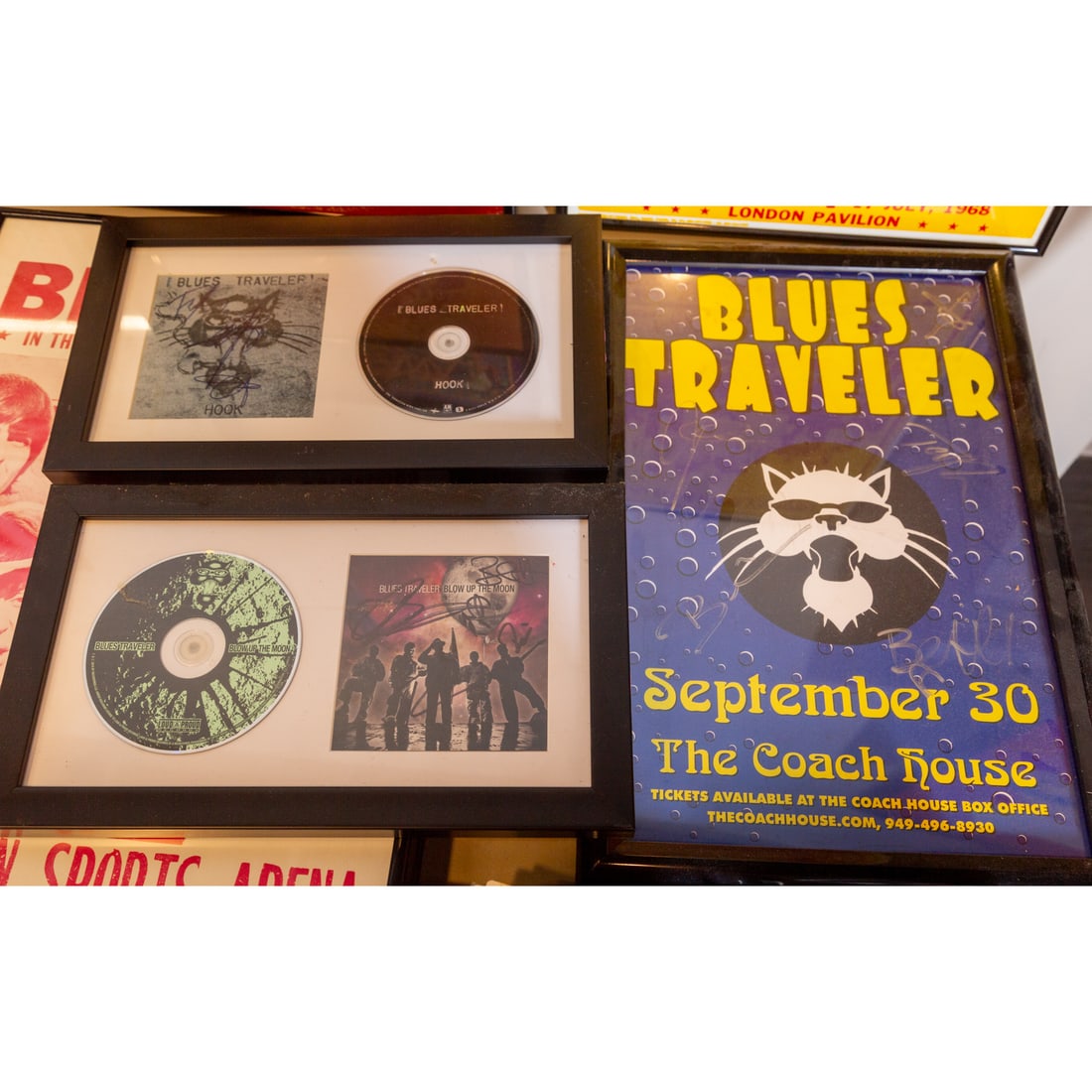 Blues Traveler: Signed Concert Poster & CDs: Blues Traveler, Sept. 30th, The Coach House signed concert poster; and Blues Traveler "Hook" and "Blow up the Moon" signed and framed CDs Provenance: From a lifelong collection of a Baltimore resident