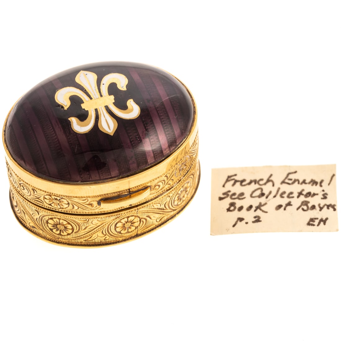 A Continental 18K & Guilloche Enamel Pill Box: 18K yellow gold Continental oval pill box featuring an aubergine guilloche enamel lid with white enameled fleur-de-lis, the body engraved with a continuous frieze of scrolling foliage, hinged, stamped