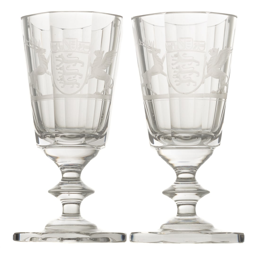 A Pair of Schonwalder Kristall Armorial Goblets: Circa 1960s or 1970s, paneled clear crystal goblets with wheel etched armorials, in velvet lined presentation case, 6 in.H Provenance: This is a rare presentation gift to a German city official