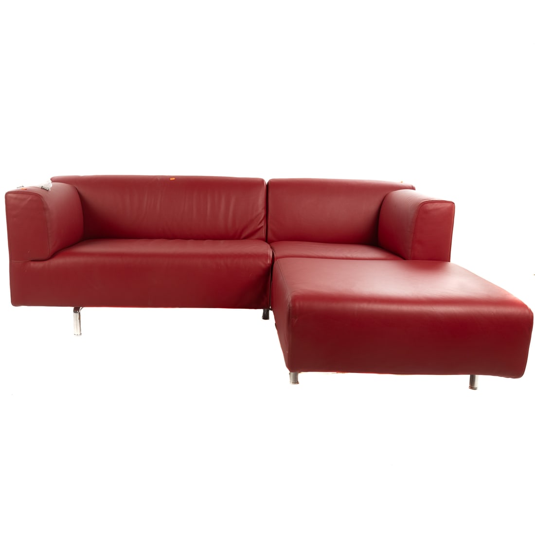 Cassina Modern Red Leather Sofa with Chaise: Contemporary, red leather upholstery, on heavy frame with chrome legs, 27 in. H, 82 in. L, 68 in. D (at chaise section)
