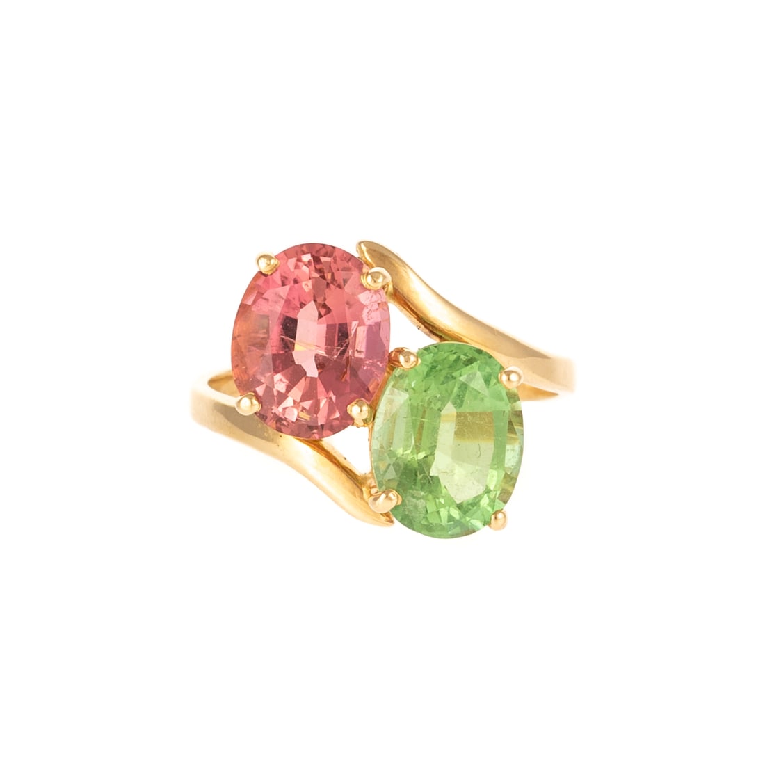 A Bypass Pink & Green Tourmaline Ring in 14K: 14K yellow gold toi et moi ring featuring oval faceted fine pink and green tourmalines, each measuring 8 x 10 mm set in four prong basket heads, sz 8.5, 4.1 grams From a Private Collection, Baltimore,