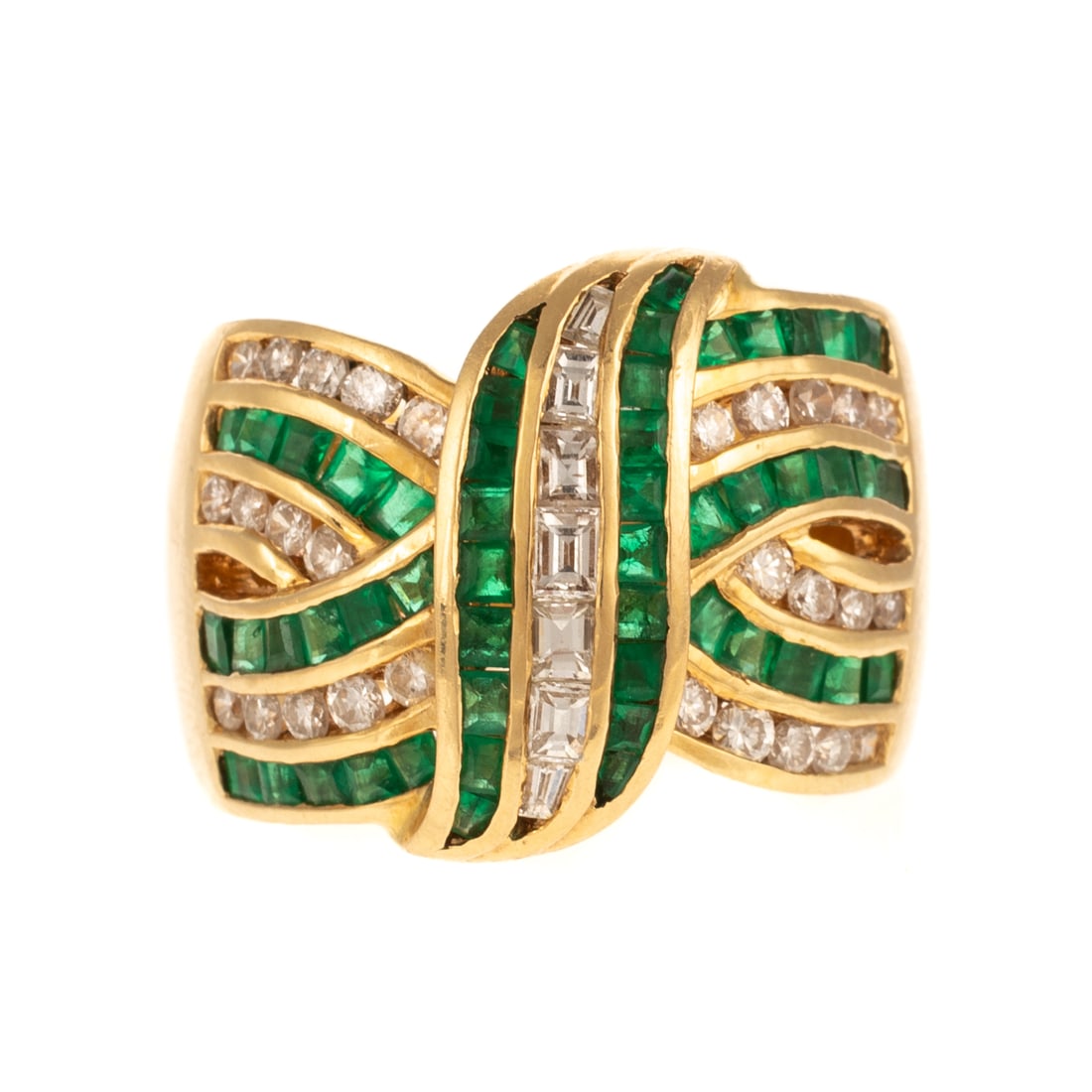 A Wide Emerald & Diamond Ribbon Band in 18K: 18K yellow gold wide band featuring very fine well matched square emeralds weighing approx. 1.40 ctw and round/baguette diamonds weighing approx. 1.20 ctw channel set in interlocking ribbon design, in