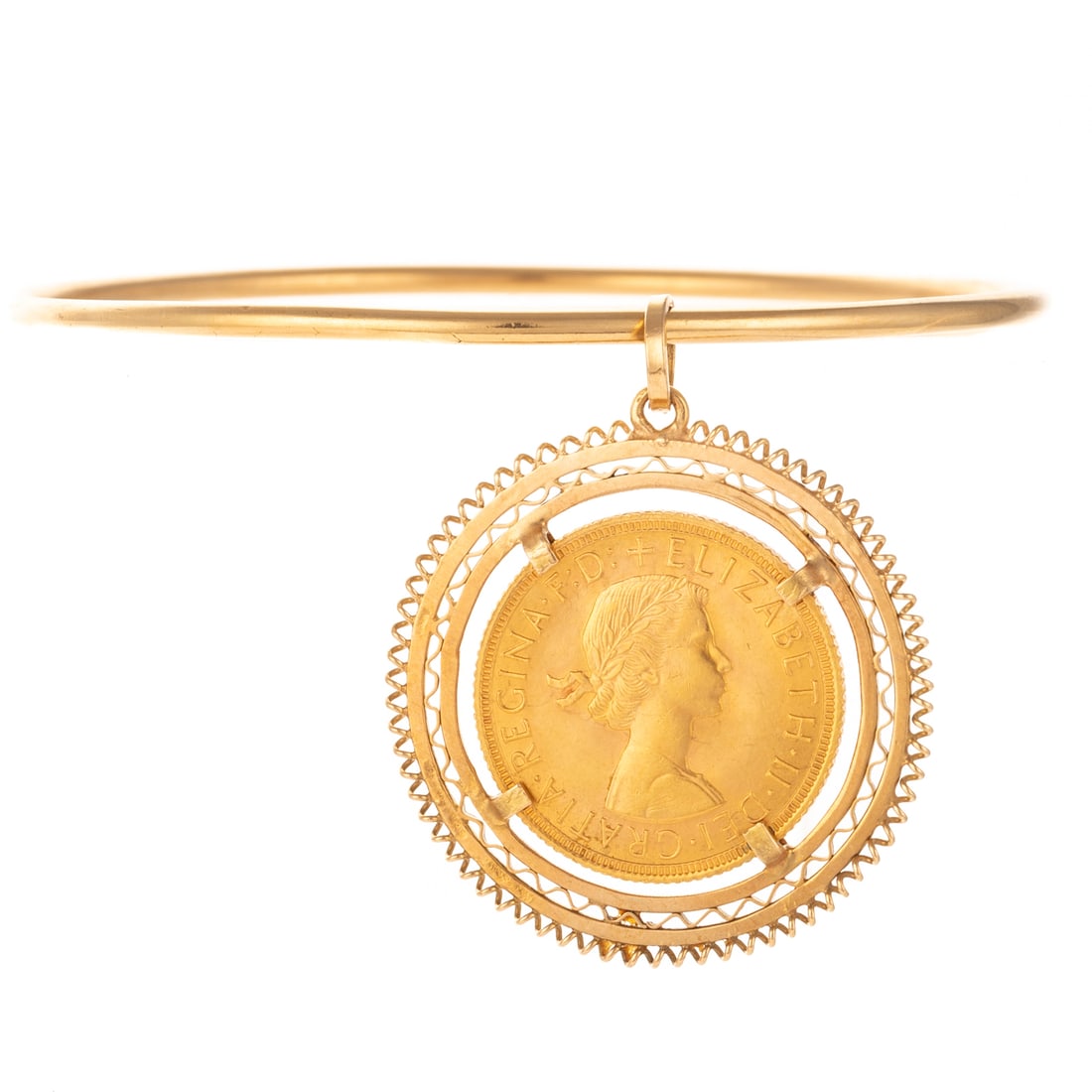 1958 Gold Sovereign Bezel Set Coin on Bangle in 18K: 1958, London gold Sovereign coin depicting Queen Elizabeth II on front and St. George and the Dragon on obverse, .900 fine gold purity, 18K yellow gold filigree bezel suspended from an 18K yellow gold