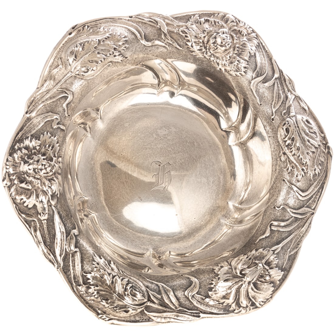 Dominick & Haff Art Nouveau Sterling Bowl: 1904 date mark, circular, with swirling body, the undulating rim decorated with a border of flowing sculptural repousse flowers, against a stippled ground, centered with a monogram, 2 1/2 in. H overal