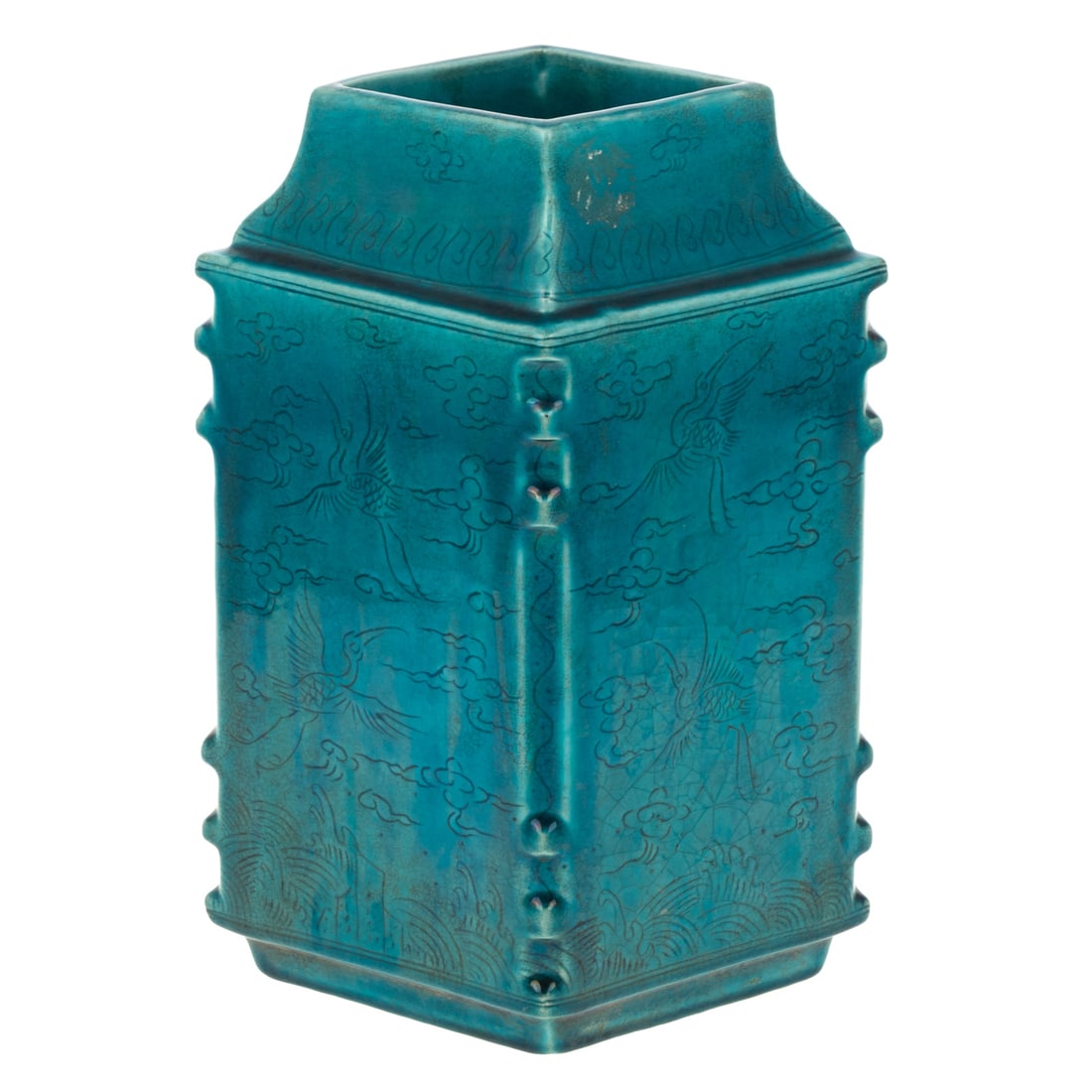 A Chinese Turquoise Enamel Vase: Zhengde six character mark, but probably late 19th century, a Chinese turquoise enamel flat-sided vase of diamond-shaped section, incised with scenes of cranes flying above the sea, the bisque covered