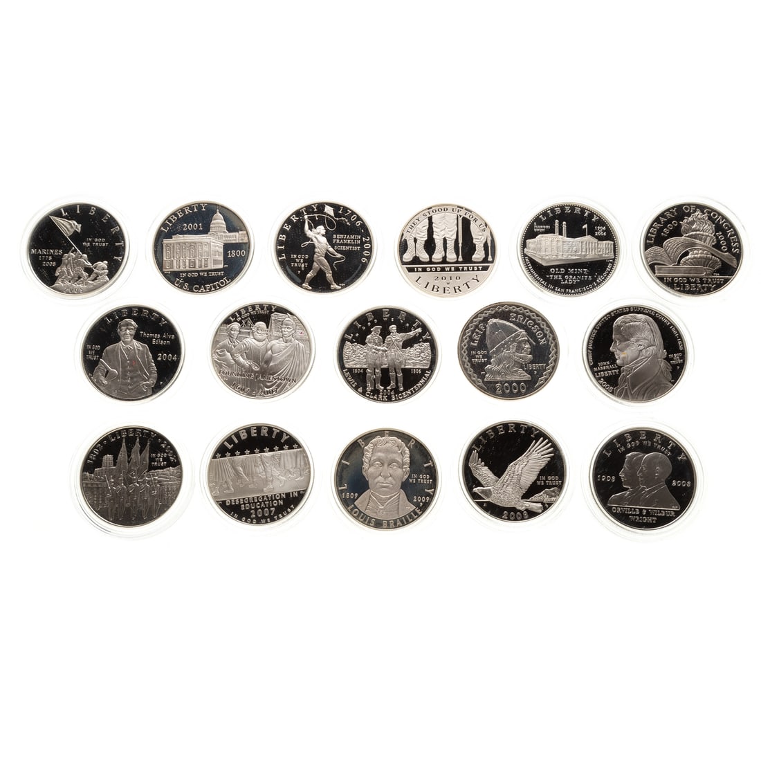 16 Proof Silver Commemorative Dollars: 2000 - Leif Erikson, Library of Congress; 2001 - US Capital; 2002 - West Point; 2003 - First Flight; 2004 - Edison, Lewis and Clark; 2005 - John Marshall, Marines 2006 - Ye Olde Mint, 2007 - Little Ro