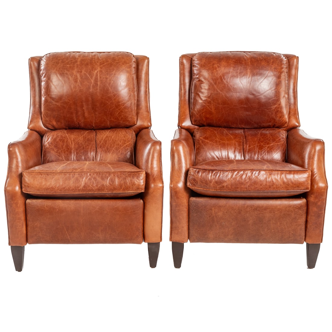 A Pair of Arhaus Distressed Leather Recliners: 38 1/2 in. H, 30 in. W, 29 in. D