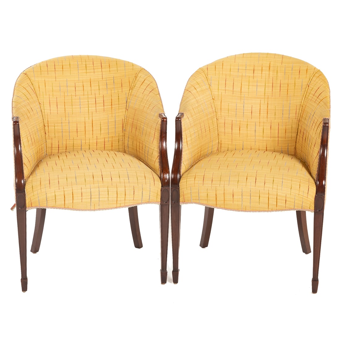 A Pair of Mahogany Upholstered Tub Chairs: A pair of fully upholstered tub chairs with curvelinear arms ending in square tapered legs and spade feet, 34 in. H, 24 in. W, 22 in. D