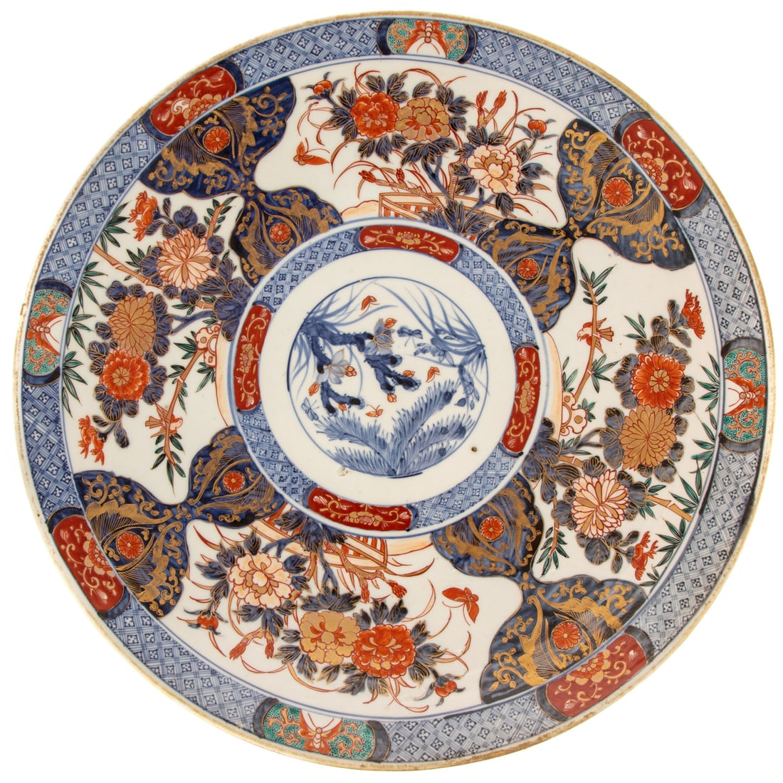 A Japanese Imari Charger: 19th century, a Japanese Imari charger with floral motifs and gilt accents, 2 1/2 in. H, 18 3/4 in. Diam.