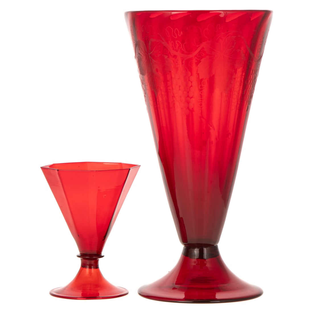 A Carder for Steuben Grape Vase & Steuben Goblet: A Selenium red Frederick Carder for Steuben engraved grape vine vase, #6034, with acid etched Fleur-de-lis "Steuben" signature on bottom, 12 in. H, approx. 6 1/2 in. Diam.; and a ruby red Steuben gobl