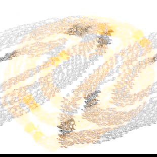A Torsade of 4.0 - 4.5 mm Cultured Pearls in 14K: Adjustable length strand of cultured freshwater oblong pearls measuring 4.0 - 4.5 mm strung with knots in between each pearl, total length 36 in., with five14K yellow gold decorative open work and bea