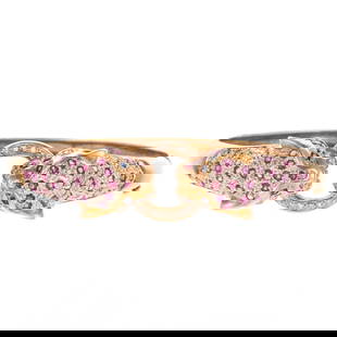 A Ruby & Diamond Cheetah Head Bangle in 14K: 14K yellow gold featuring two highly textured cheetah heads with ruby and diamond spots and sapphire eyes facing each other holding a pave diamond ring in their mouths, signed, hidden box clasp with