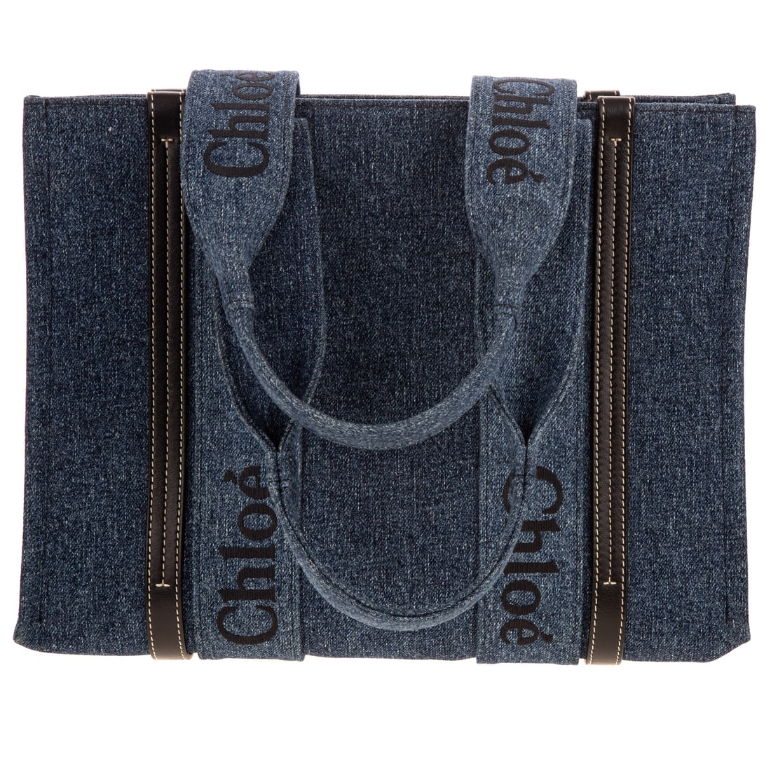 A Chloe Denim Medium Tote: A blue denim Chloe Tote with dual shoulder straps, and leather trim embellishment. Blue denim lining and single interior flat wall pocket. Includes care instructions, dust bag, and original sales tag.