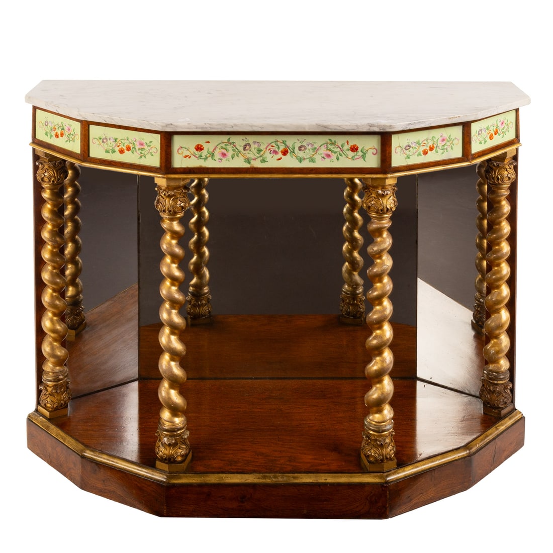 Continental Style Marble Top Console Table: Circa 1900, seven sided shaped marble top over an apron embellished with floral painted porcelain panels, supported by four gilt barley twist columns, mirrored back resting on a partial gilt rosewood