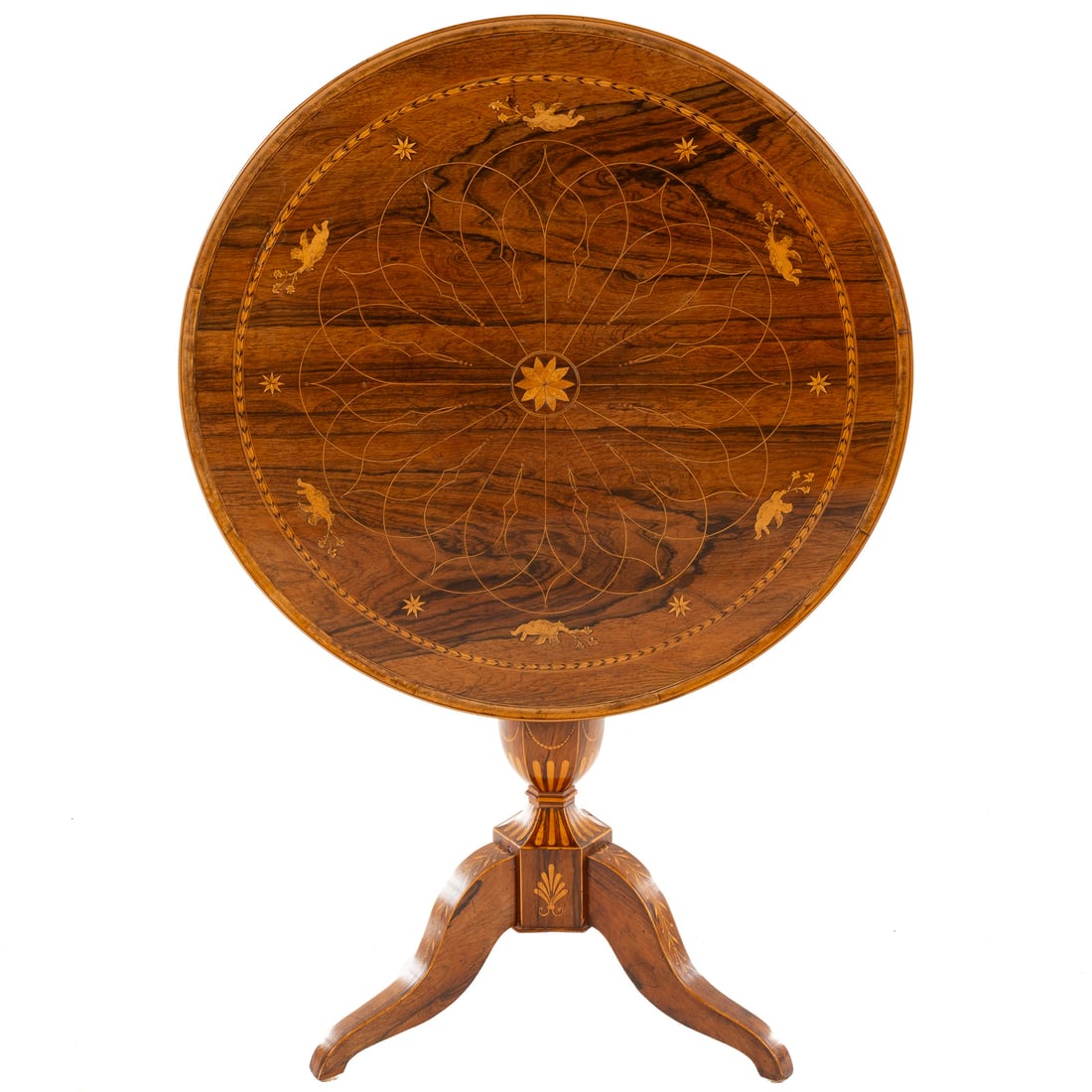 Inlaid Coromandel Wood Tilt Top Tea Table: Circular top with intricate string inlay with marquetry inlaid cherubs, stars and banding over a inlaid carved tripod base, 45 1/4 in. H, 29 1/2 in. Diam. (open)