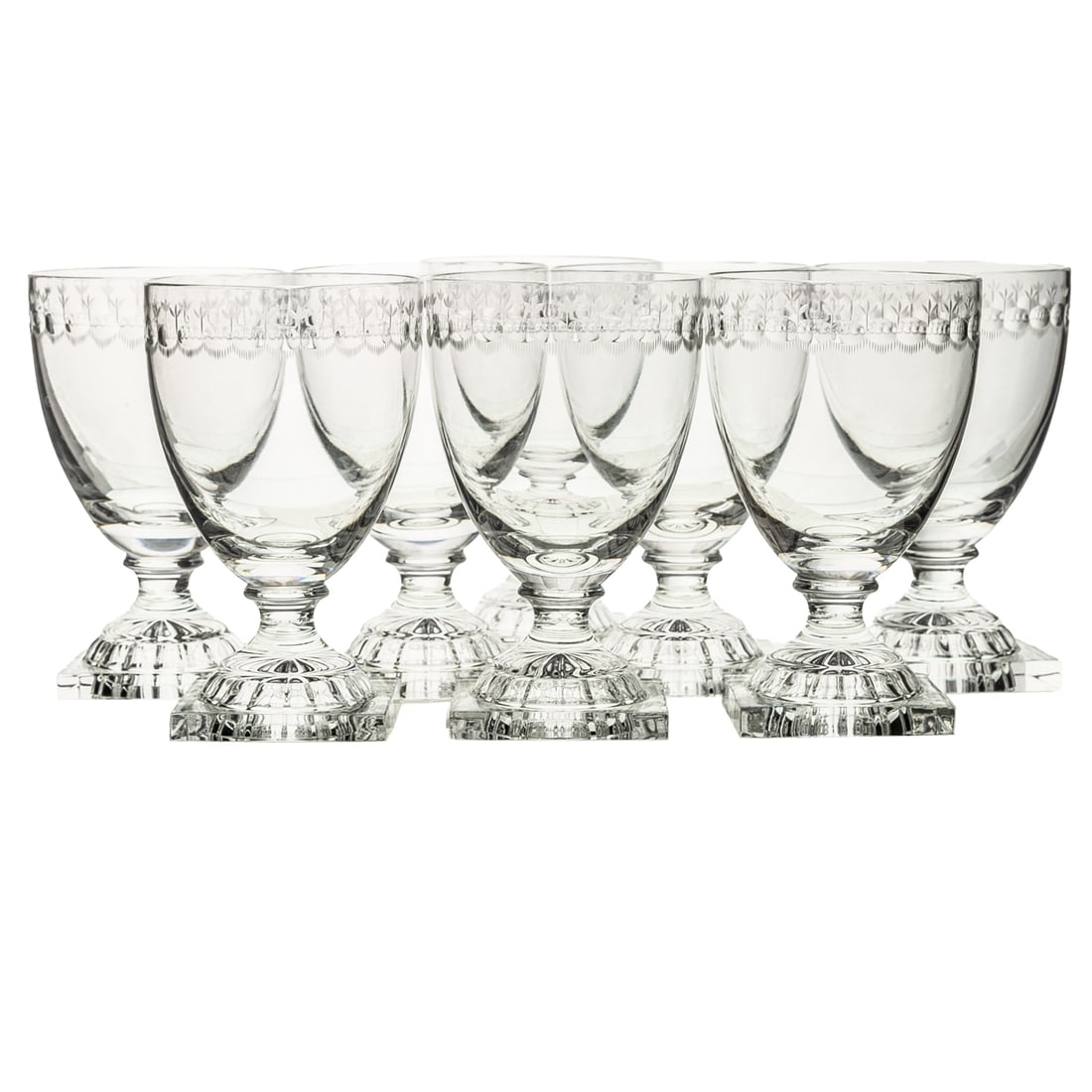 Eight William Yeoward "Stella" Crystal Wine Goblets: (English, 1983) Eight William Yeoward "Stella" colorless crystal wine goblets with etched and cut band and rising on a square foot, acid etched marks on the bottom of each glass, 5 1/2 in. H, approx.