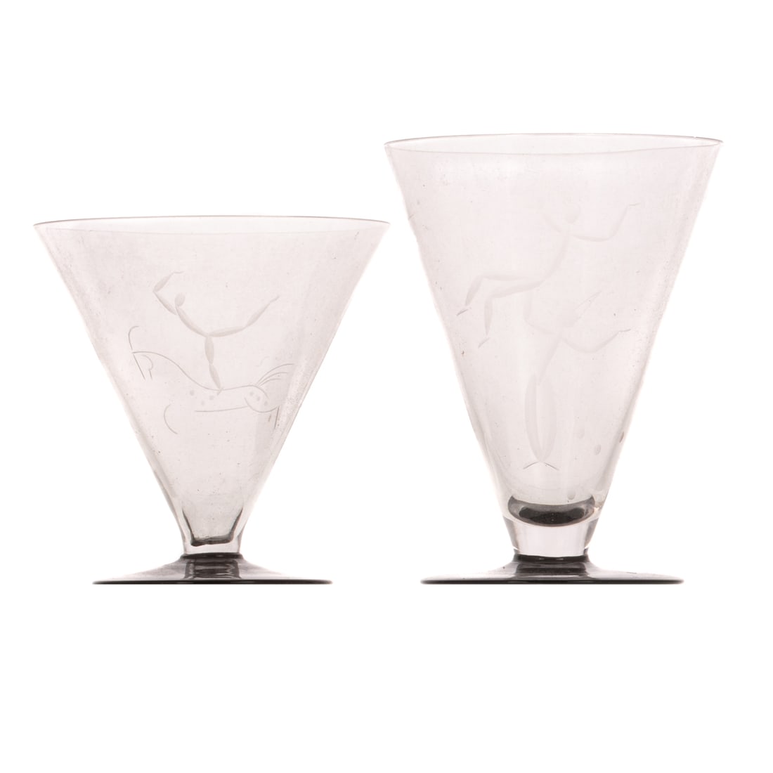 15 Orrefors Edward Hald & Simon Gate Art Deco Glasses: 15 colorless with black base Orrefors Edward Hald and Simon Gate Art Deco glasses with two etched figures. 10 glasses: 4 3/4 in. H, approx. 3 3/4 in. Diam., and five glasses: 3 3/4 in. H, approx. 3 3/