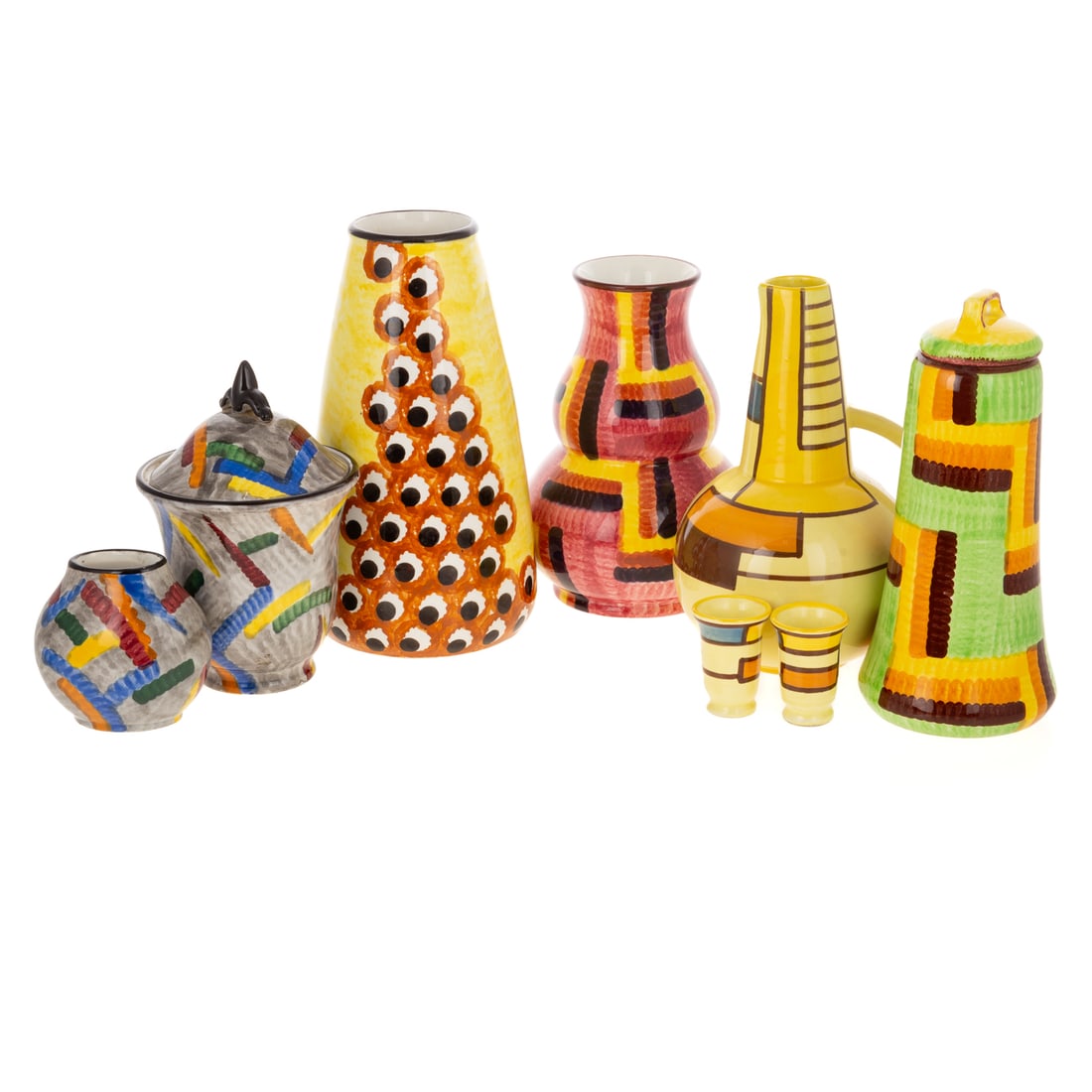 Attributed to Eva Zeisel Vases & Tableware: Comprising eight pieces of hand painted German Schramberg porcelain. Includes two lidded jars: 6 3/4 to 8 1/2 in. H; miniature vase: 3 1/4 in. H, 3 1/2 in. W, 2 1/2 in. D; two shot glasses: 2 1/4 in.