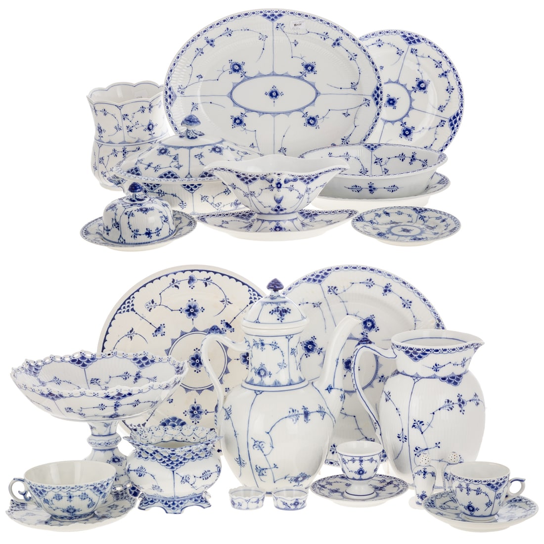 Royal Copenhagen "Blue Fluted Half Lace" Partial Service: Comprising 73 pieces. Includes six rim soup bowls, five large rim soup bowls, five dinner plates, six luncheon plates, five bread/butter plates, three demitasse cups and saucers, six large flat cups a