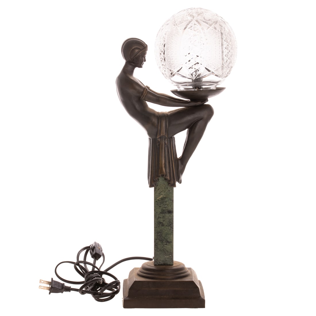An Art Deco Figural Lamp After Pierre Le Faquays: An Art Deco figural lamp with a round cut glass shade and marble neck, depicting a seated female figure with her hands outstretching holding the round cut glass shade, approx. 18 1/2 in. H, 7 1/2 in.