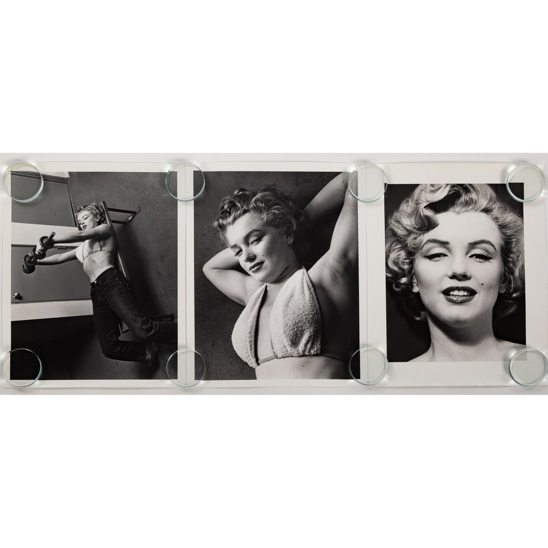 Philippe Halsman. Three Photographs of Marilyn Monroe: Comprising three 11 x 14, original silver gelatin prints by Philippe Halsman, including two shots from his photo series of Marilyn with barbells circa 1952, ed. 100/250 and ed. 100/250, and an additio