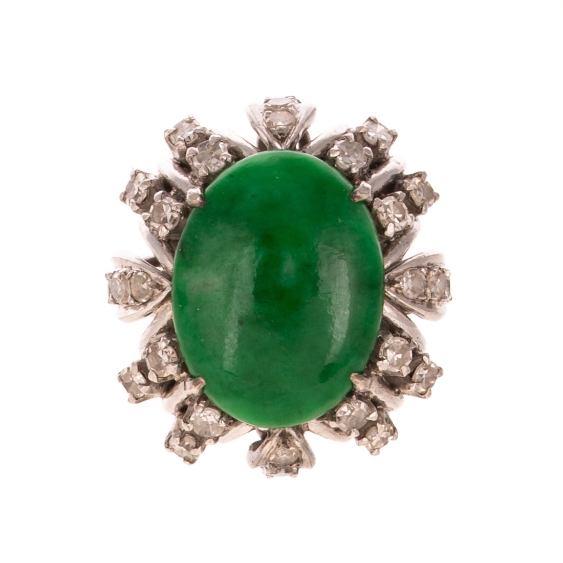 A GIA Type A Jade & Diamond Ring in 18K: 18K white gold ring featuring a prong set oval type A Fei Cui jadeite cabochon with no indication of dye or impregnation of color, measuring 14.3 x 11 mm, accompanied by a copy of GIA Gemological Repo