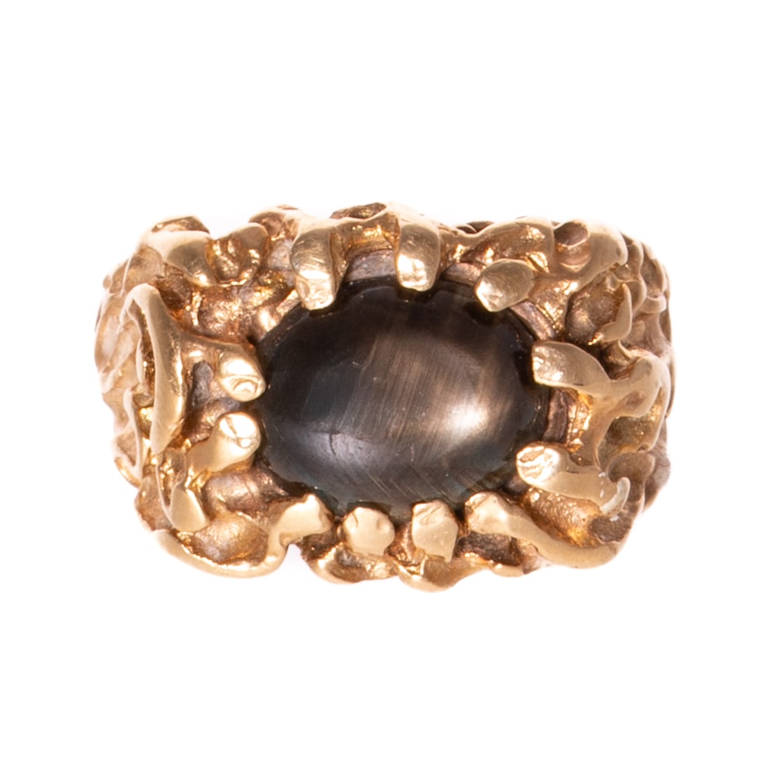 A Brutalist Style Black Star Sapphire Ring in 14K: 14K yellow gold ring featuring an oval black star sapphire measuring 8.5 x 11.5 mm, prong set in nugget Brutalist setting, sz 8, 13.2 grams Provenance: From a distinguished private collection, assembl