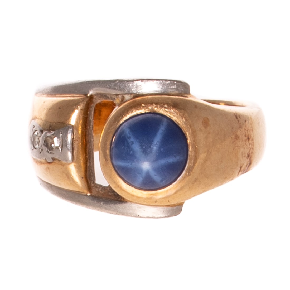 A Synthetic Star Sapphire & Diamond Ring in 14K: 14K yellow and white gold ring featuring a round synthetic star sapphire measuring 6.5 mm, bezel set with two bead set diamonds on one side, sz 6.5, 10.6 grams Provenance: From a distinguished private