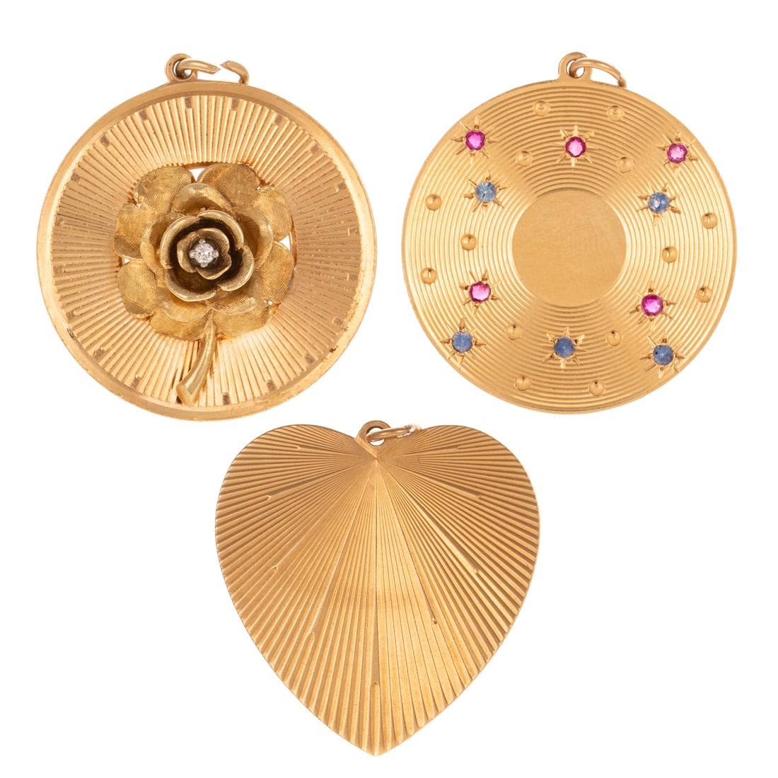 A Trio of Large Vintage Charms in 14K: 1) 14K yellow gold disc charm with round rubies and sapphires star mounted in channel engraving on one side, personalized engraving on the other, 1 1/2 in. L, 2) 14K yellow gold charm featuring a rose