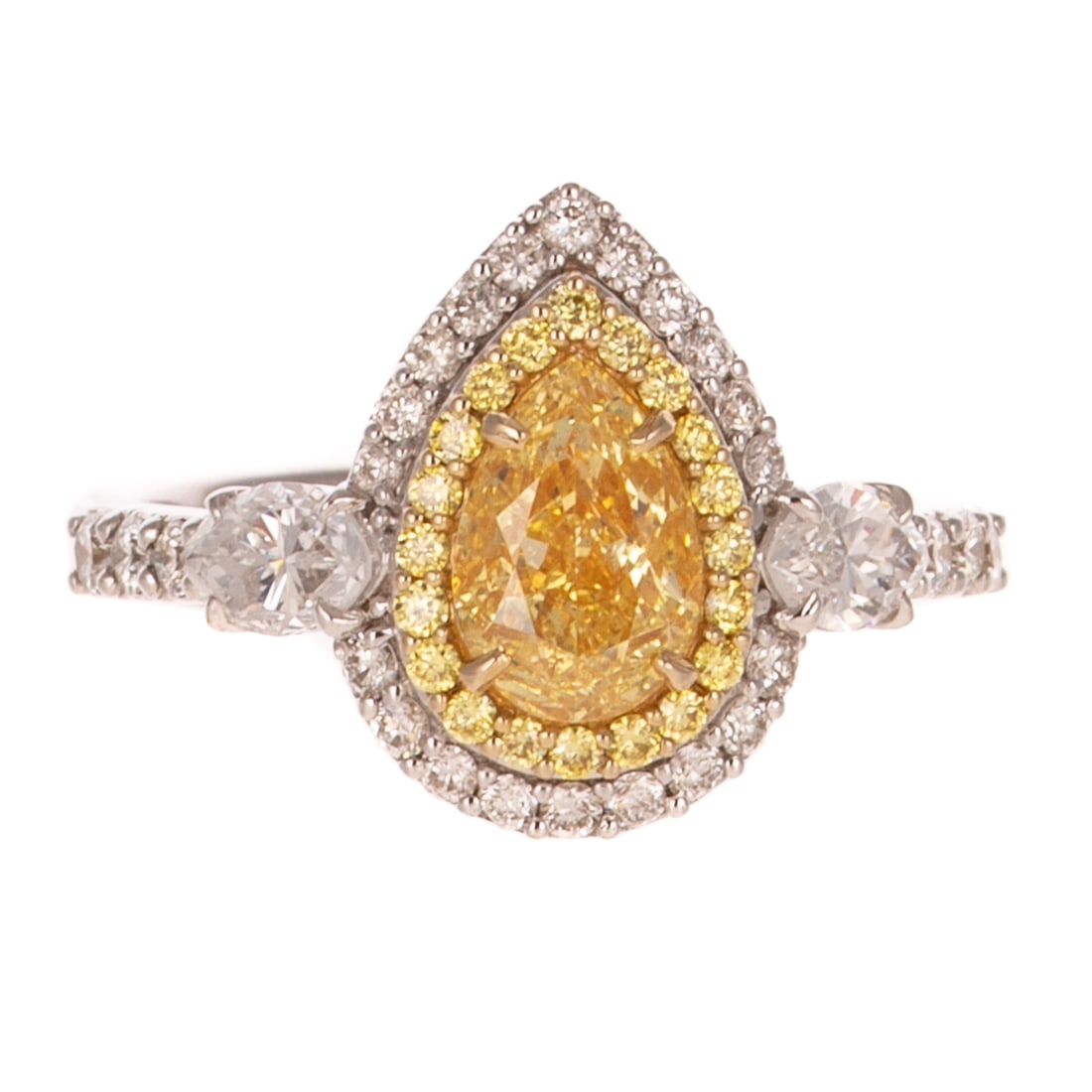 A GIA 1.01 ct Fancy Yellow Diamond Ring in 18K: 18K white gold ring featuring a prong set pear shaped Fancy Yellow diamond weighing 1.01 cts with a clarity grade of SI2, accompanied by a copy of GIA Gemological Report #2468516814, surrounded by a