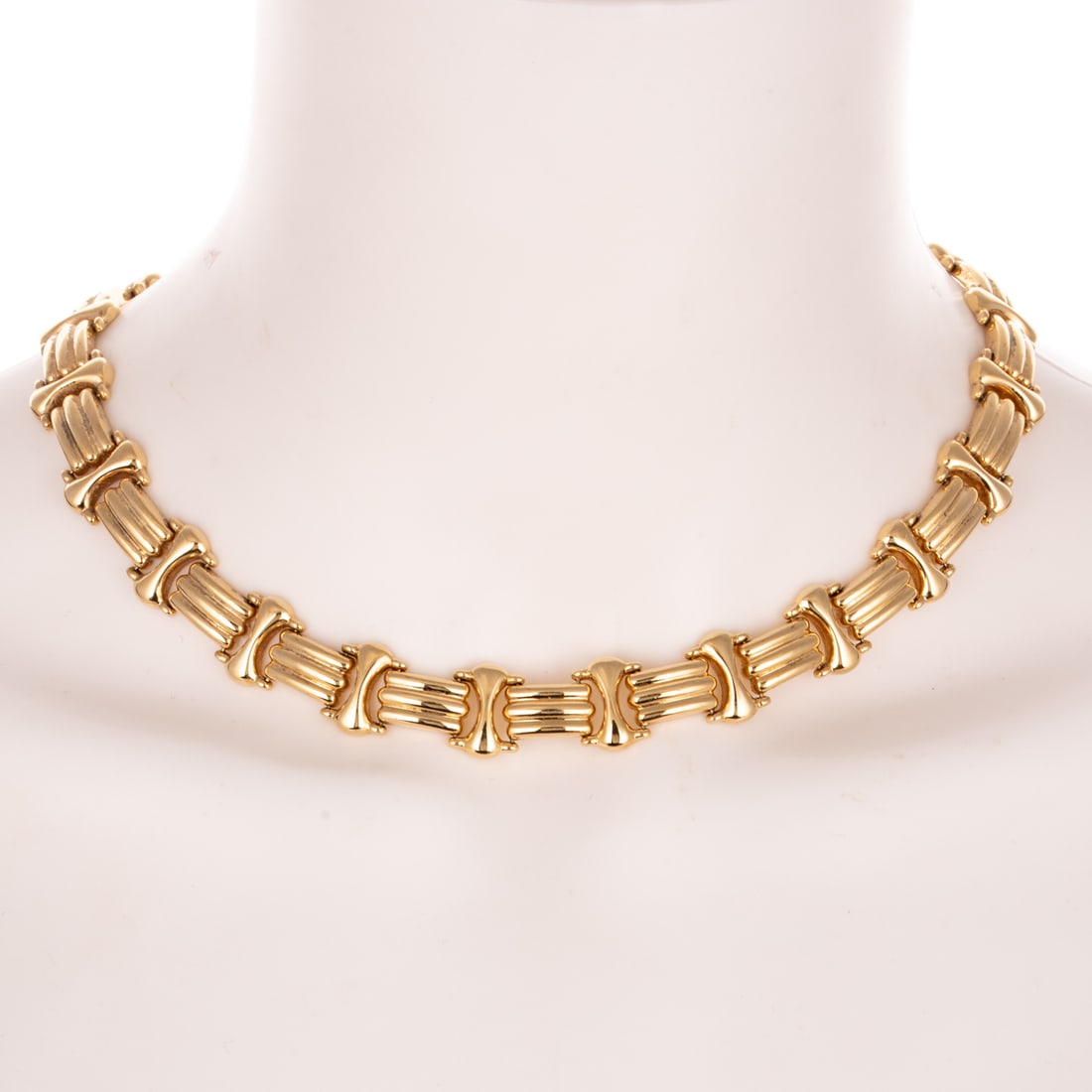 A Classic Wide Link Necklace in 14K: 14K yellow gold necklace featuring high polish triple row rectangular links alternating with hourglass shape links, hidden box clasp with safety latch, 16 1/2 in. L, 46.9 grams
