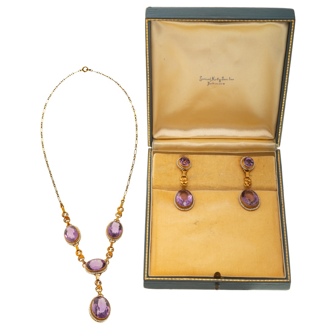 A Victorian Amethyst & Seed Pearl Demi-Parure in 14K: c.1870s, 14K yellow gold matching necklace and ear clips set featuring well matched oval light purple amethyst with seed pearl halos and floral figure eight links, necklace has think paperclip chain i