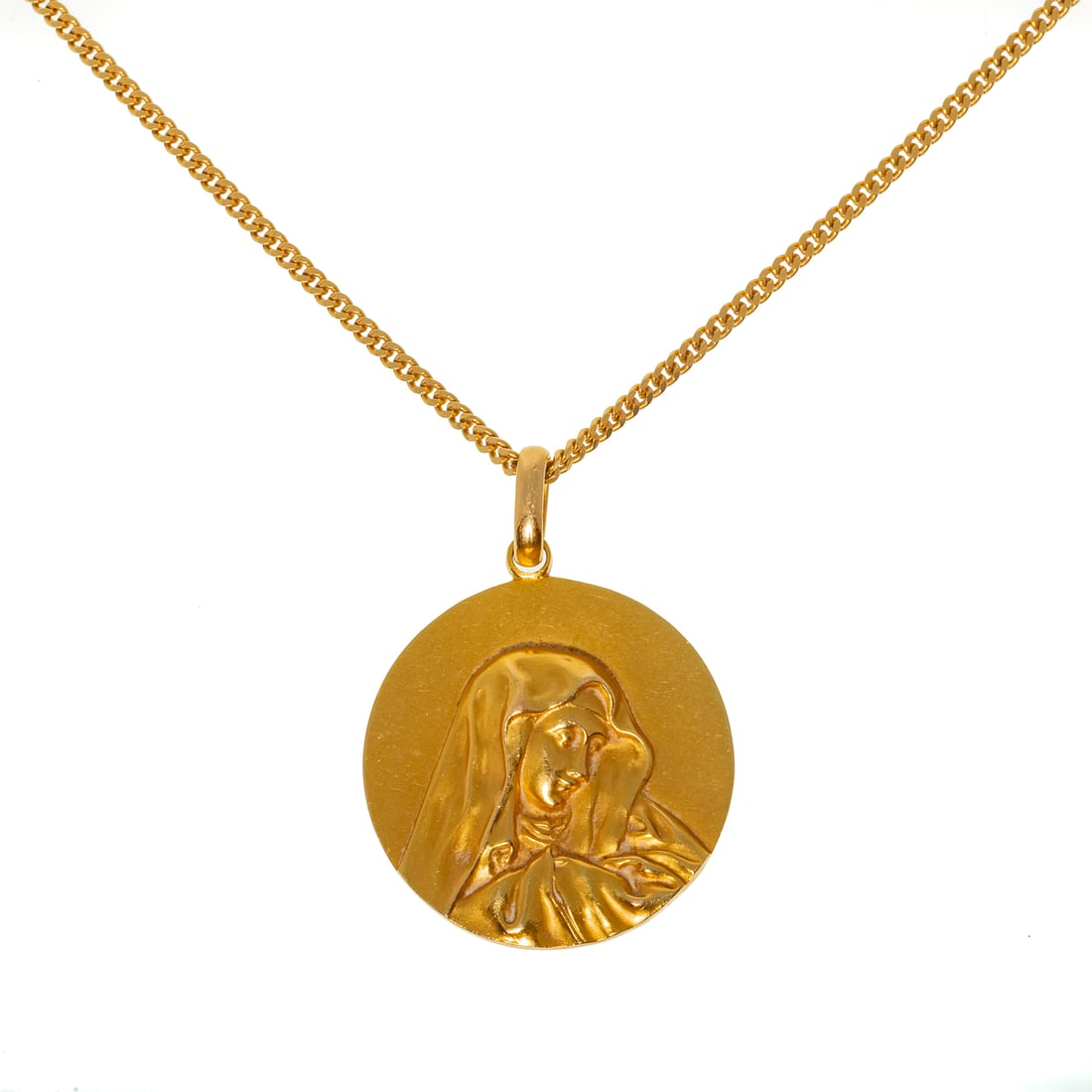 A Monogrammed Virgin Mary Pendant in 18K & 14K: 18K yellow gold medallion pendant with Virgin Mary on front and interlocking monogram on the back, 1 1/4 in. W, hanging on 14K yellow gold curb link chain, 2 mm W, with rectangular box clasp with safe