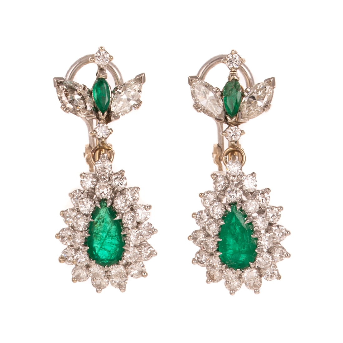 A Pair of Emerald & Diamond Dangle Ear Clips in 14K: 14K white gold dangle earrings featuring marquise and pear shape well matched emeralds weighing approx. 2.60 ctw with larger marquise diamonds at the top and double halo of diamonds surrounding pear s