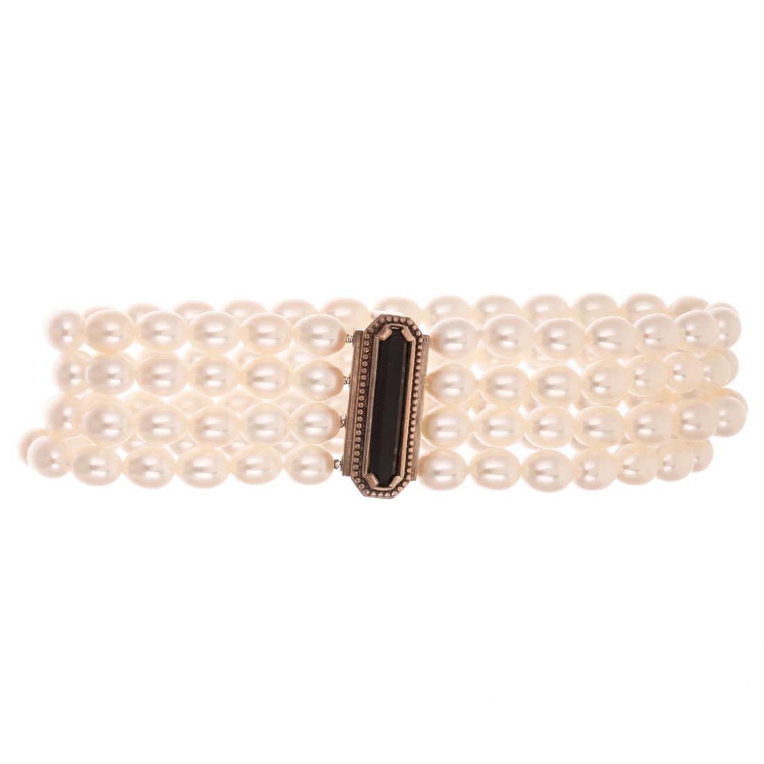 A Tiffany & Co Ziegfeld Collection Pearl Bracelet in Sterling Silver: Sterling silver multi-strand pearl bracelet by Tiffany & Co from the Ziegfeld Collection featuring four strand of fresh water pearls with sterling silver and black onyx bar clasp, signed, accompanied