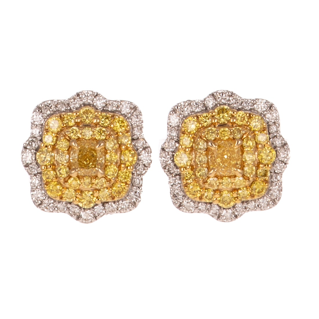 A Pair of Yellow Diamond Halo Studs in 18K: 18K white gold earrings featuring prong set square cushion cut yellow diamonds in the center of a double halo or prong set yellow diamonds and a third outter halo of prong set white diamonds, all