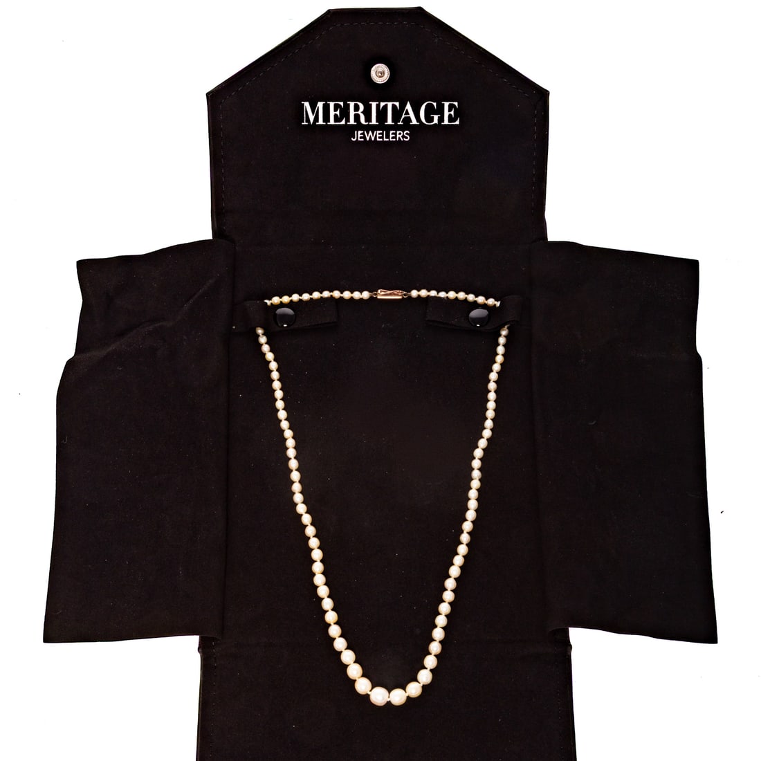 A GIA Strand of Natural Pearls: Strand of natural pearls ranging from 7.4 mm to 3.5 mm accompanied by GIA Gem Identification Report #1949770, May 10, 1991, 94 well matched pearls with dark cream color, 9K yellow gold barrel clasp wi