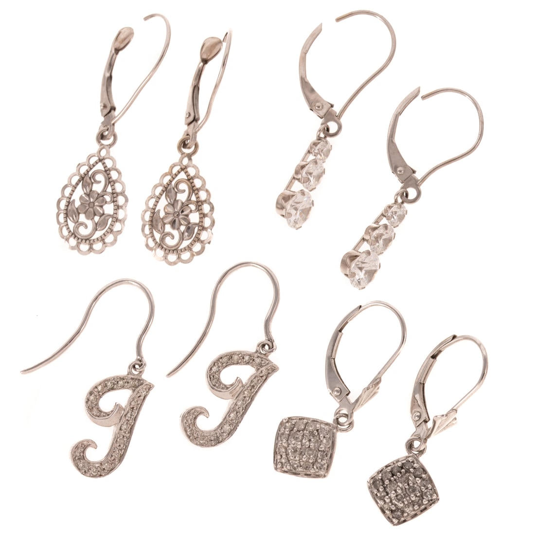 Four Pairs of Dangle Earrings in 14K & 10K: 1) 14K white gold dangle earrings featuring a trio of graduated round diamond simulants, lever backs, 1 1/8 in. L, 2) 10K white gold initial dangle earrings with round diamonds, bead set, hook backs,