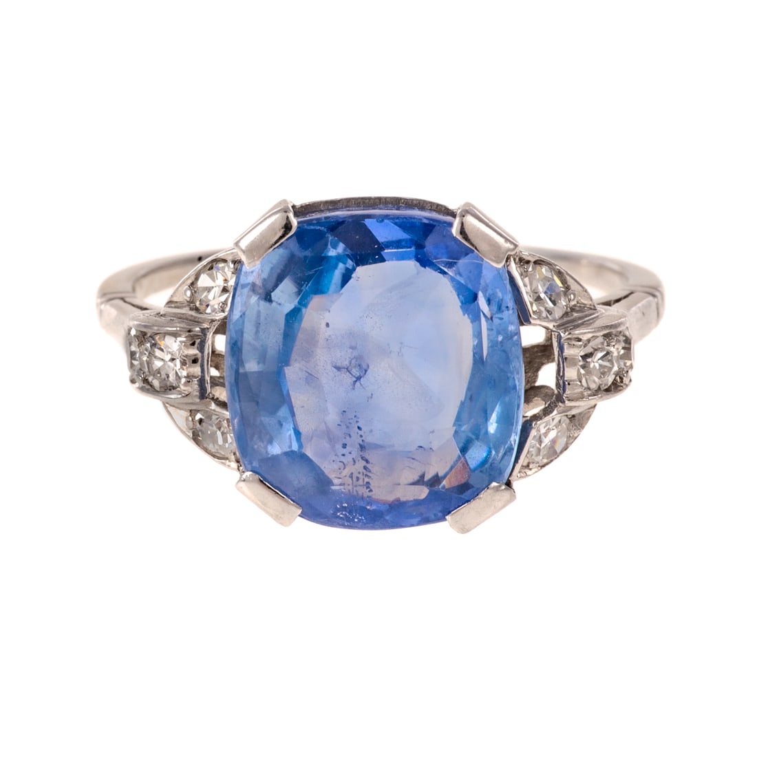 An Art Deco Tiffany & Co. Unheated Sapphire Ring in Platinum: c.1920, platinum ring by Tiffany & Co featuring a cushion cut unheated sapphire weighing 6.06 carats (weighed loose) accompanied by GIA Sapphire Report #2195192543 with antique round diamonds bead set