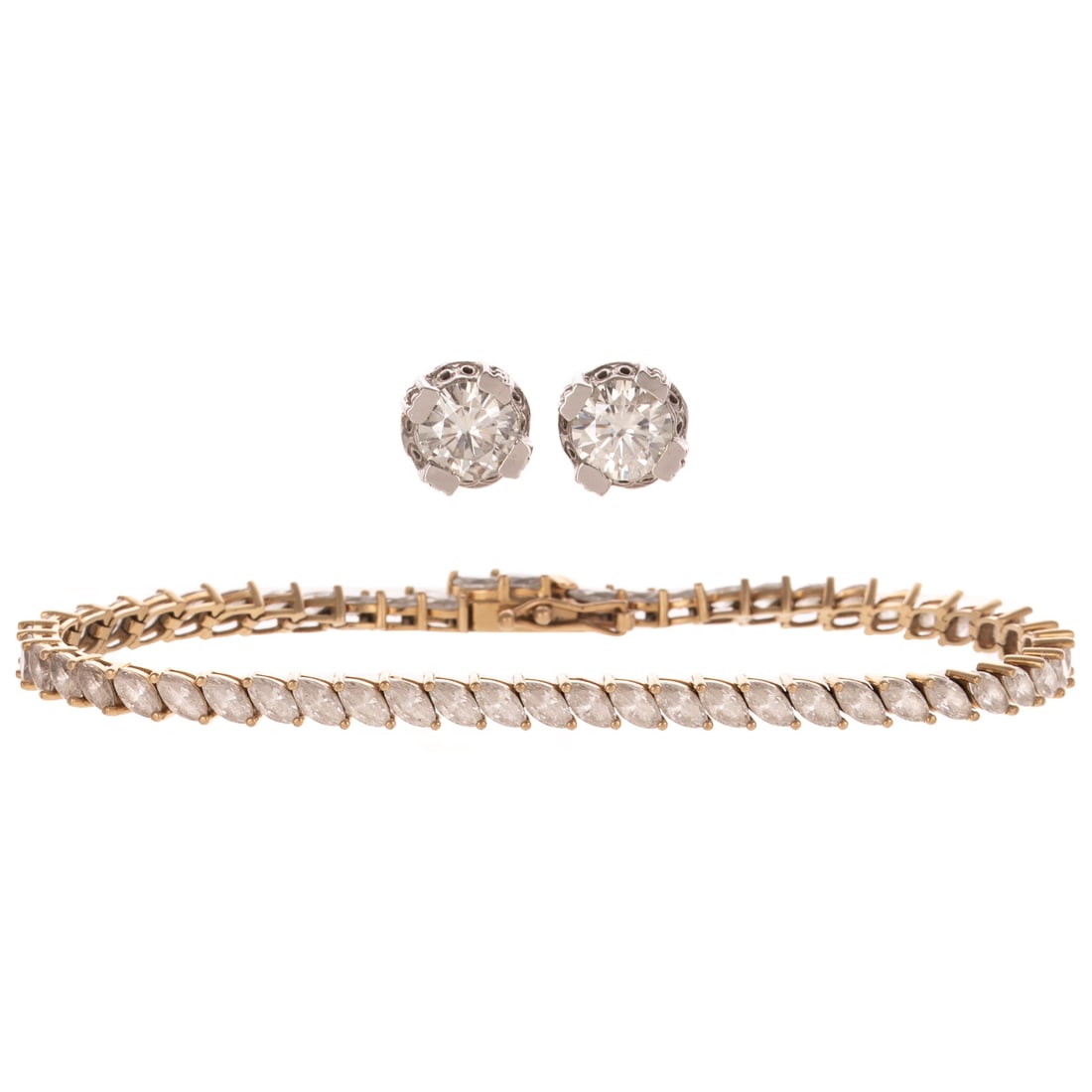 A Pair of Simulant Ear Studs & Bracelet in 14K: 1) 14K yellow gold bracelet featuring marquise cut CZ, prong set on the diagonal, hidden box clasp with double safety, 7 1/4 in. L, and 2) 14K white gold pair of ear studs featuring round diamond simu